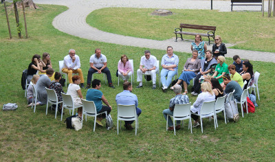 people sitting in a circle outdoors