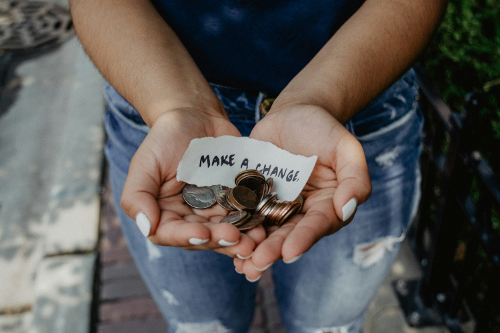 hands holding coins, words, make a change